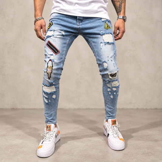 Men's light blue ripped patch skinny jeans clean product photo