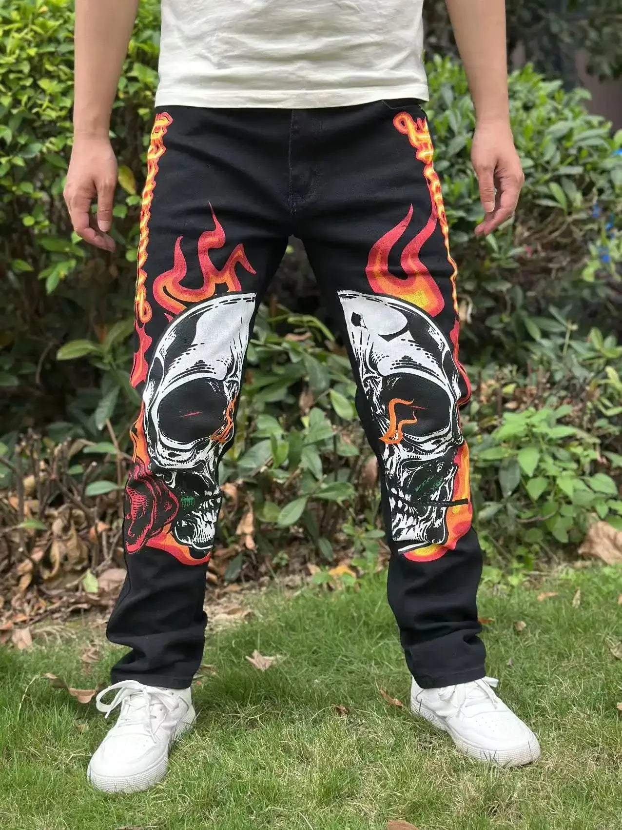 Street casual wear, men's jeans, fashionable printed patterns, classic style trousers with cinched waist design. Black color