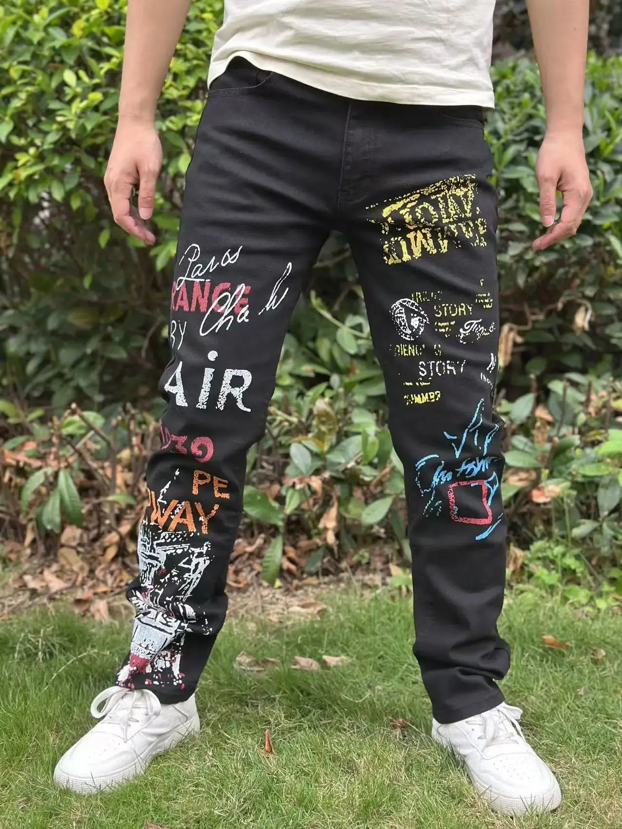 Street casual wear, men's jeans, fashionable printed patterns, classic style trousers with cinched waist design. Black color
