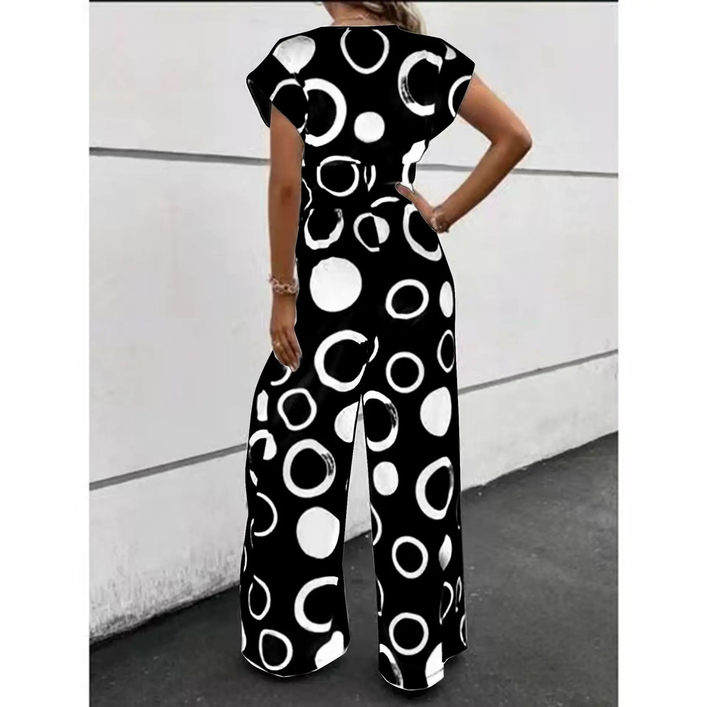 Fashion, elegance and leisure V-neck high waist printed wide leg belt jumpsuit.