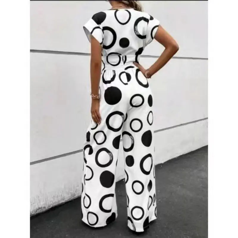 Fashion, elegance and leisure V-neck high waist printed wide leg belt jumpsuit.