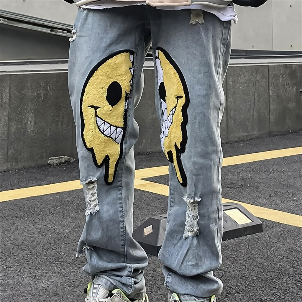 Unisex ripped baggy jeans with smiley patches