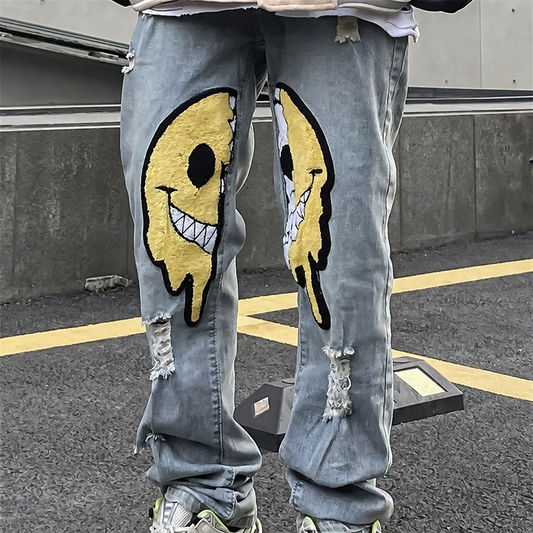 Unisex ripped baggy jeans with smiley patches