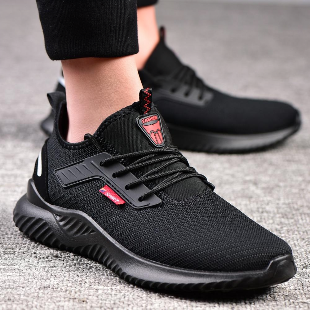 Steel-toe work safety shoes black mesh on feet clean lifestyle photo
